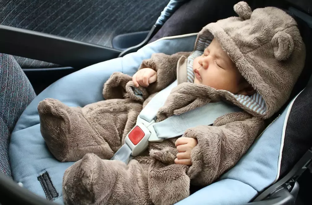 baby sleeping in the car